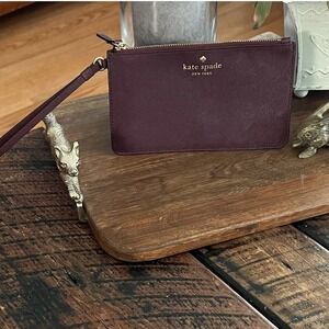 Kate Spade plum/maroon colored wristlet/clutch